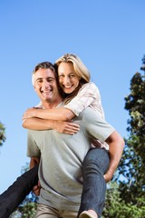 Happy couple having fun in the park