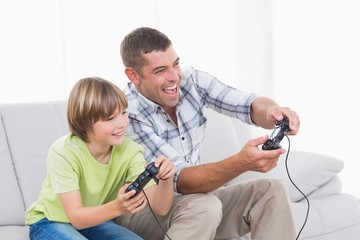 Father and son playing video game