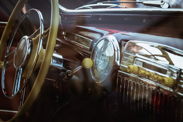 Dashboard and steering wheel in retro car interior