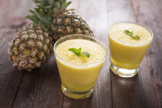 pineapple smoothie on wooden table
