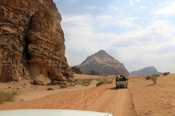 cars of tourists in the desert of Jordan