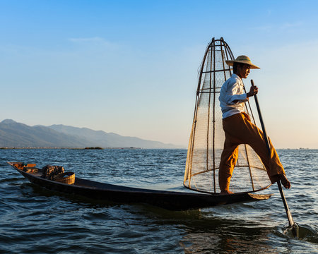Traditional Burmese fisherman at Inle lake - Powered by Adobe