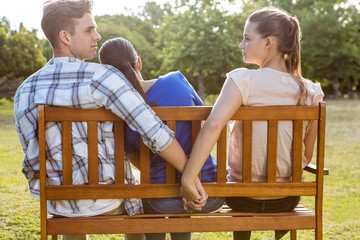 Man being unfaithful in the park