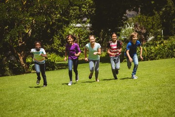 Obraz na płótnie Canvas Children running at park