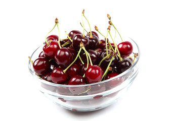 Obraz na płótnie Canvas Fresh fruit cherries in a bowl glass.