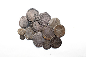 Vintage silver coins with portraits on a white background