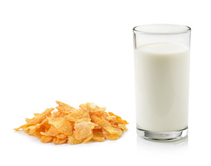 Cornflakes and glass of milk on white background.