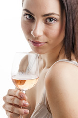 portrait of young woman with a glass of rose wine