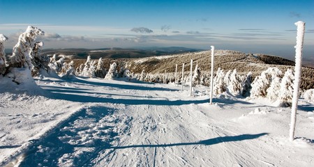 Fototapeta na wymiar view of crosscountry skiing way and mount Serak