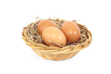 Eggs in rattan basket a healthy food gift isolated on white