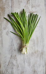 spring onions on rustic wood