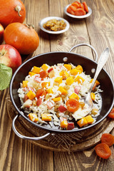 Sweet pilaf with pumpkin, apples and dried fruit