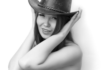 Black and white portrait of a girl with a cowboy hat 