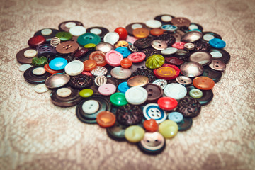 Obraz na płótnie Canvas Vintage heart of the buttons on a linen handkerchief