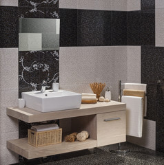 detail of a modern bathroom with white sink and towels