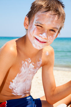 Boy with sunscreen on face