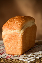 Bread on a linen towel on the wooden table
