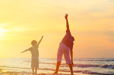 Fototapeta premium father and son having fun at sunset