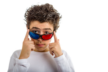 Boy wears 3D Cinema red and blue eyeglasses smiling