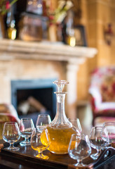 Decanter with glasses on the table.