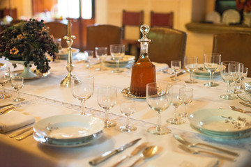 Setout table with tableware in modern restaurant.