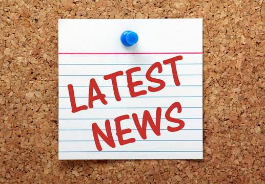 The phrase Latest News on a bulletin board