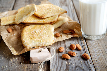 Homemade nut cookies with milk in the background