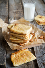 Homemade nut cookies with milk in the background