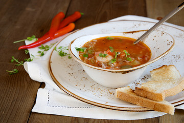 Gumbo soup on wooden background