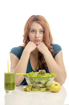 Woman on dieting, eating organic salad, an apple, smoothie