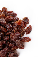 Pile of healthy raisins isolated on white background