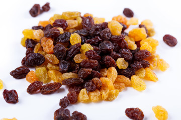Heap of sultana raisins on white background