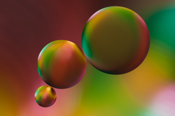drops of oil and air bubbles on the water