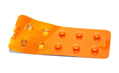 Medical cardiac pills in blister on a white background closeup
