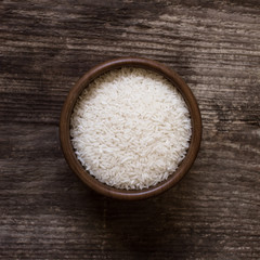 raw white rice in a bowl - top view