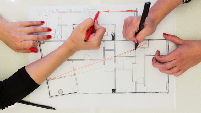 Creative Female interior designers drawing interior design plan