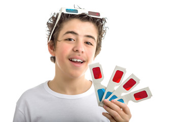 Boy wears 3D Cinema eyeglasses on his head and shows four ones i