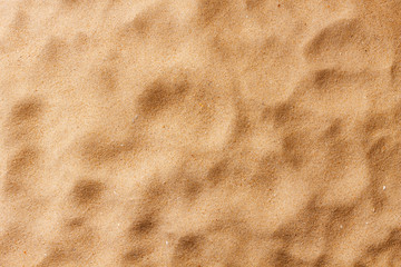 closeup of sand pattern of a beach in the summer