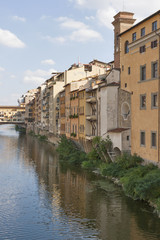 Fototapeta na wymiar Residential buildings close to bridge Ponte Vecchio in Florence