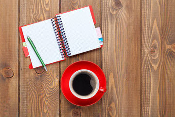 Office desk table with supplies and coffee cup
