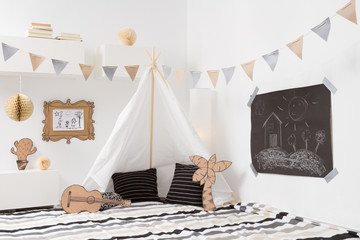 Playroom for kids with Teepee and garlands