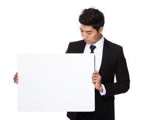 Mixed Indian businessman hold with white board