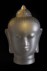 Buddha head on black background