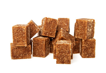 Brown sugar cubes on a white background