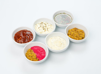 Fototapeta na wymiar Variety of sauces in white bowls