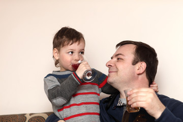 Father with son have drinks