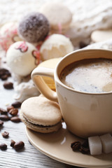 Gentle colorful macaroons and  coffee in mug