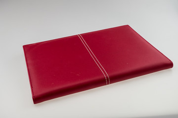 Blank red hardcover book isolated on white background with copy