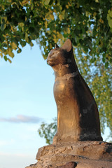 Pet monument. Cat statue on sky background
