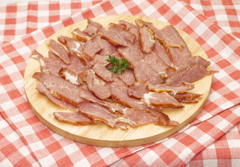 Appetizing sliced ham on cutting board